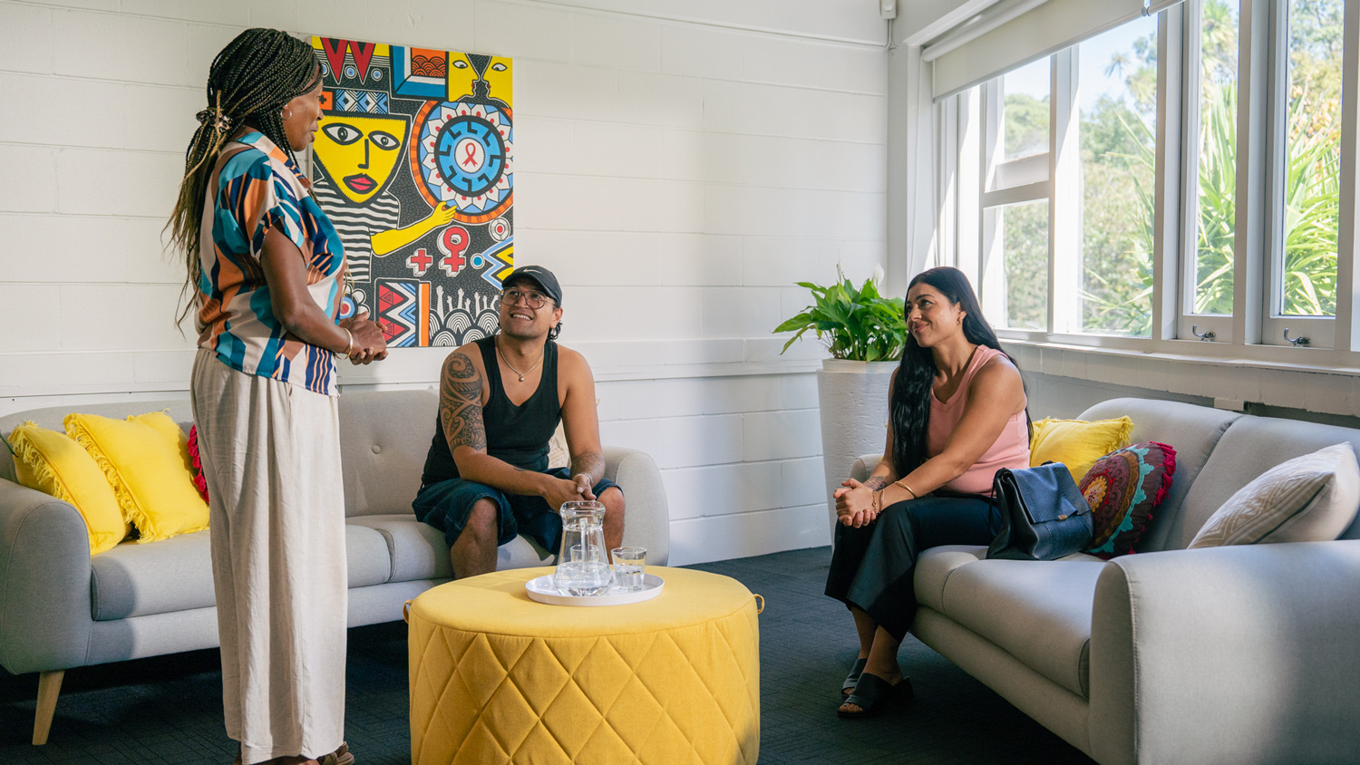 Photo of three people working together in a modern office environment